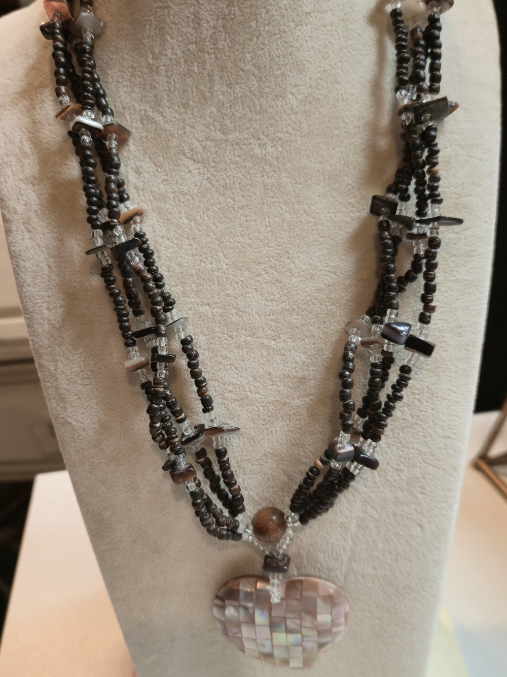 Multi-Strand Black Beaded Necklace with Iridescent Heart Pendant